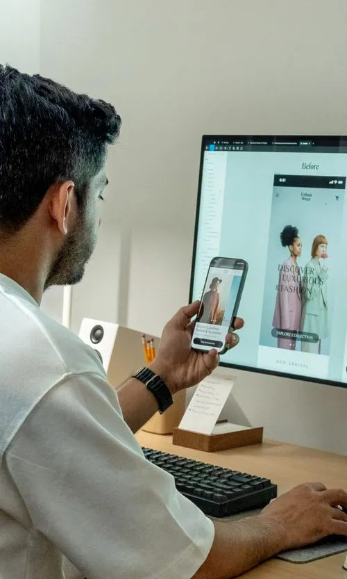 Faizur reviewing a design on his phone